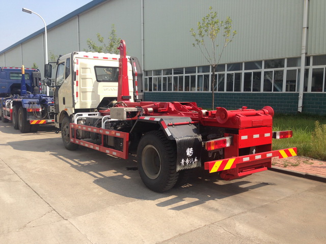 Hook arm garbage truck